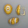 18k gold yellow sapphire and diamond jewelry teardropshaped leverbacked earrings and a ring ca 1999 bombe forms pave set yellow sapphires with white gold diamond accents 20 cts and 77 ct 2