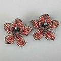 Fancy color sapphire and diamond orchid earrings naturalistically rendered patinated 18k white gold pave petals with shaded red and orange sapphires 54 cts tw diamond accents 8 dwt 125 gs