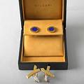 Two pairs 18k gold designer earrings ca 1980 bvlgaribvlgari stud earrings with lapis cased 916 paloma picasso for tiffany  co x earrings with diamonds approx 36 ct tw 1 12 13 dwt