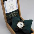 Chronoswiss lunar chronograph ca 2004 18k gold ref 7521  8 178 sateen engineturned face with lunar phase and sub seconds 12 hours and 30 minutes original strap and 18k gold buckle in wood