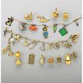 Figural charms and charm bracelets 19201960 14k gold bracelet suspends 14k gold charms gf bracelet suspends enameled egyptian revival alfred penguin pixie coral lucky pig etc eleven assorte