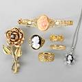 14k and 18k gold jewelry collection 19001960 seven items include hinged 14k bracelet with conch cameo and seed pearls hardstone cameo pendant with diamonds and a ring three ornate gold bands bi
