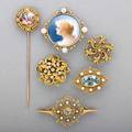 Enameled 14k gold jeweled brooches or pins six items in the renaissance or rococo revival styles includes aquamarines pearls diamonds opals and enameled portraits ca 1900 211 dwt 341 gs