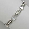 Louis comfort tiffany moonstone bracelet ca 1915 cushionshaped moonstone cabochon links alternate with filigree diamond triplet links platinum marked tiffany  co 115 dwt 18 gs 7 12 x 3