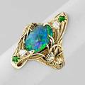 Walton  co black opal and diamond ring ca 1900 oval black opal 115 x 75 mm two omc diamonds and two green garnet accents nestles among 14k yg gold pinecones and branches transcendent arts