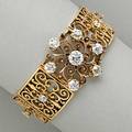 14k gold diamond scroll and panel bracelet circular scroll cluster and pierced panels with fourteen oec diamond principal stone approx 105 cts approx 485 cts tw 258 dwt 403 gs 6 34