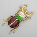 Victorian jeweled gold beetle brooch 15k yg staghorn beetle with diamond platinum vertex head demantoid garnet thorax shaped garnet elytra diamond suture ca 1895 9 dwt 14gs 2