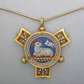 Micromosaic gold agnus dei necklace 19th c circular pendant of minute tesserae depicts lamb of god on blue ground with three red and floral panels 2 x 1 34 suspending from recent 14k yg snake