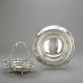 Ornate american silver 19001930 georgian pattern centerbowl by whiting for je caldwell  co everted garland rim with gadroon edge watson pierced swing handled basket with scroll and floral m