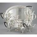 Tiffany  co silver coffee service and cake stand nine pieces 19101947 coffeetea service includes seven hollow pieces and waiter tray urn forms with incised neoclassical bands urn finial and e