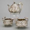 Edward farrell silver coffee service three pieces in the tenier style london 1821 squat forms embossed with cherubs at leisure flowering scroll lion mask feet figural female bust handles the c