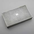 Tiffany  co silver cigar box 19131947 rectangular with hinged lid and sides embossed with minute persian texture vacant cartouche partially wood lined 30 ot gw 9 14 x 5 34 x 1 78
