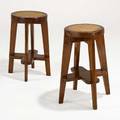Pierre jeanneret pair of round high stools from the scientific block at chandigarh franceindia 1960s teak cane one has stenciled numbers 26 34 x 18 14 provenance chandigarh india liter