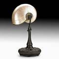 Tiffany studios nautilus table lamp new york ca 1900 bronze nautilus shell silvered metal single socket base stamped tiffany studios new york s1544 14 12 x 8