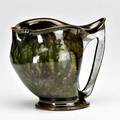George ohr fine pitcher with cutout handle spongedon green and gunmetal brown glaze biloxi ms 1890s stamped ge ohr biloxi miss 4 34 x 5 12 published ellison george ohr art potter