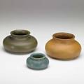 Grueby three squat vessels in matte green blue and ochre glazes boston ma ca 1905 each with circular pottery stamp largest 3 14 x 5 12