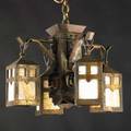 Arts  crafts brass chandelier with monk heads ca 1915 brass patina on iron caramel slag glass unmarked 14 12 x 20 dia