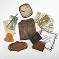 Roycroft assorted items and ephemera mostly east aurora ny tooled leather purse billfold and address book two commemorative copper card trays roycroft inn matchbook and 24 postcards some in s