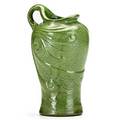 Roseville rozane egypto pitcher in curdled green glaze with scrollwork decoration to body rozane seal 7 14 x 4 12 x 4 dia
