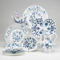 Meissen blue onion seven items 19th20th c teapot sauce tureen gravy boat nappy reticulated round platter and 2 twosection serving dishes crossed swords mark teapot 9 34