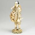Japanese bone or ivory figure basket seller early 20th c 12 12
