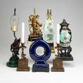 20th c lighting seven table lamps include handpainted with celadon glaze chinese gilt carved wood pair of fauxpainted gryphon candlesticks etc tallest 19