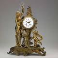 French figural bronze clock time and strike movement with porcelain dial early 20th c 23 x 16 x 8