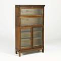 Lundstrom oak three section barrister bookcase with cabinet below early 20th c 60 x 34 x 13 12
