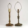 Oscar bach two patinated bronze table lamps with reticulated bases of birds and theatrical masks new york c1925 both marked taller to top of harp 23