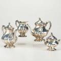 Italian 800 silver coffee service four pieces twistedfluted design scroll handles and finials 19341944 coffee pot with ivory insulators 8 14 teapot with ivory insulators 7 14 covered su