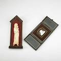 Religious group two pieces shell cameo of madonna and child in gold plated mountings in gilt decorated moroccan leather with easel frame bone carving of a mother and child taller 10 14