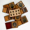 Tin types and daguerreotypes fortyfour pieces photo album with thirtysix small tin types mainly children some wearing union caps and eight daguerreotypes 19th c largest 3 34 x 3 14