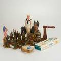 Ww ii figurines toys etc approx twenty plaster composite or cast iron items mid 20th c medics with stretcher nurse radio man flag bearer fire truck us mail bank political interest playin