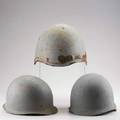 Wwii helmets three us navy flak and two steel pots with inserts unmarked largest 9 12 x 11 x 13