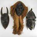 Three ivory coast masks two senufo and one guro 20th c largest 14 x 7