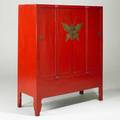 Red lacquer asian cabinet four door with brass butterfly center medallion 20th c 64 x 53 x 21