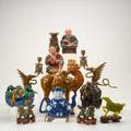 Asian figures thirteen pieces hardstone dragons horse and libation cup reticulated soapstone vase bronze vase with dragon pair of brass and enamel winged griffin candlesticks tang style camel