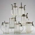 German steins seven glass with pewter lids c 1890 one with figural eagle finial one with harp finial two with porcelain inserts etc unmarked tallest 9 12