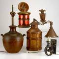 Arts  crafts lighting etc five pieces two copper and glass lanterns handled copper table lamp wrought iron sconce and door knocker all unmarked largest lantern15 x 8