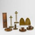 Roycroft etc nine pieces pair of candlesticks pair of bookends low bowl pair of chambersticks single candleholder all roycroft together with similar sconce unmarked hammered copper and bra