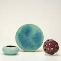Van briggle three pieces cabinet bowl in teal persian rose flower frog and plaque with grape bough in blue over teal all marked plaque 8 12 dia