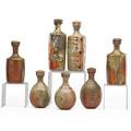 Jason hess seven reductioncooled woodfired stoneware bottles with stoppers flagstaff az artists chopmark to each stopper tallest 9 provenance collection of burt cureton and cheryl traiger