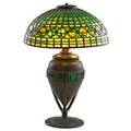 Tiffany studios fine table lamp with acorn shade its lighting base inlaid with turtleback glass new york 1900s bronze glass three sockets base with circular stamp and tiffany studios new york