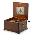 Regina music box walnut case double comb ca 1900 sold with approx sixtyone 12 discs 11 x 16 12 x 15