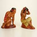 Pair of figurines two painted ceramic figurines of polynesian women wearing sarongs mid20th c  signed donoith  taller 12