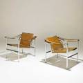 Le corbusier pair of basculant armchairs 1960s saddle leather chromed steel unmarked 25 12 x 25 x 25 12