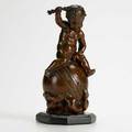 Bronze figurine putto astride a globe france 19th c inscribed h capy 6 34 x 3 x 3 12