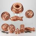 Copper molds nineteen molds with varying motifs earlymid20th c one marked kreamer largest 4 x 11 14 dia