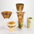Weller five pieces woodcraft wall pocket and bowl forest flower pot creamware vase and footed bowl usa early to mid20th c two marked weller largest 10 12 x 5 12 x 3