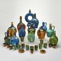Fulper twentynine pieces including ten musical decanters music boxes sixteen shot glasses etc flemington nj late 1920s glazed earthenware some marked tallest 12 12